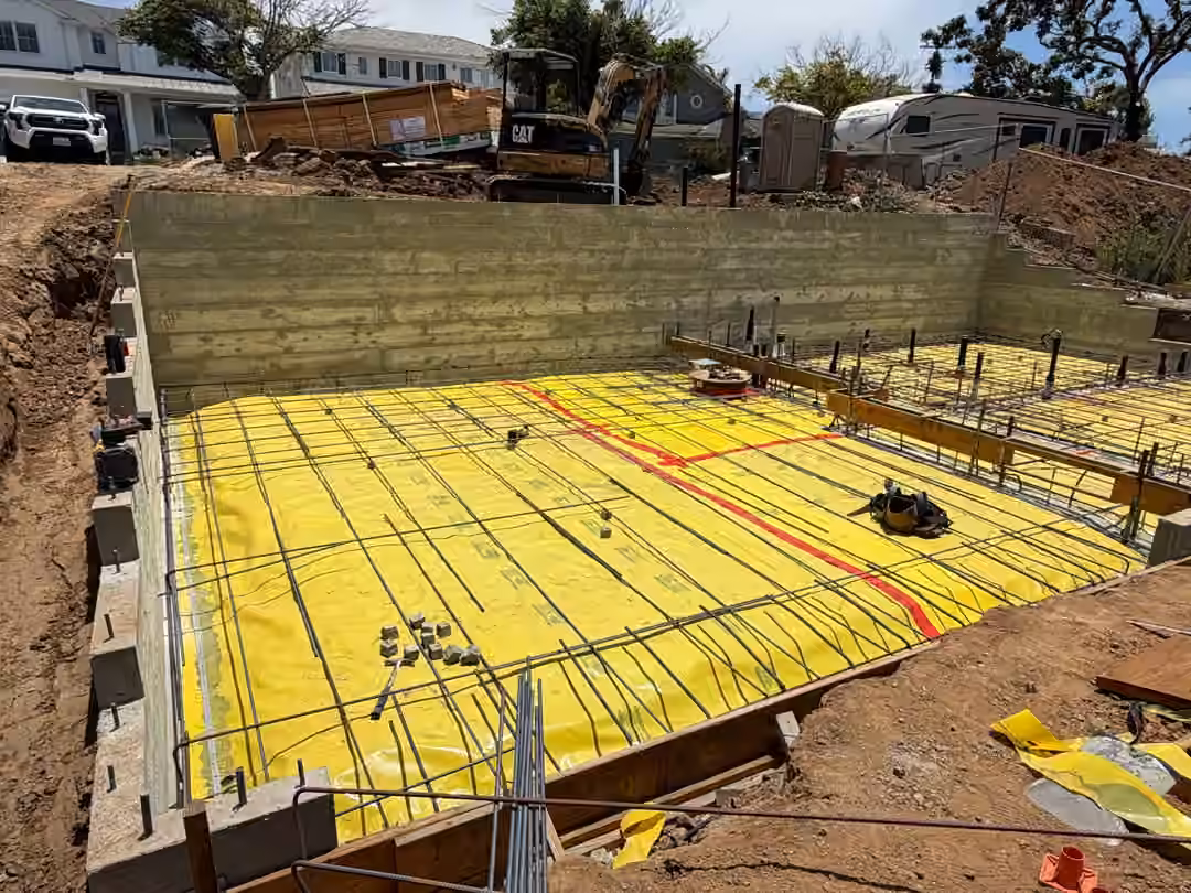 Slab reinforcement over vapor barrier